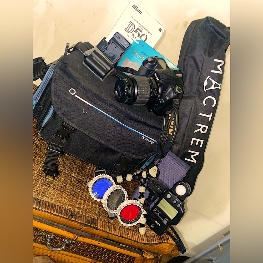 Nikon D50 digital camera with accessories, and extra battery packs.